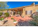 Spacious patio with seating area, surrounded by desert plants at 7143 E Canyon Wren Dr, Gold Canyon, AZ 85118