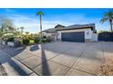 Home's exterior showcases a spacious driveway and well-maintained landscaping at 7514 N 22Nd Pl, Phoenix, AZ 85020