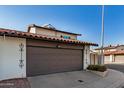 Exterior view of a home with a brown garage door and stucco exterior at 939 W Mission Ln, Phoenix, AZ 85021