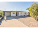 Charming single story home with a well-manicured front yard at 1017 W Whitton Ave, Phoenix, AZ 85013