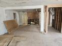 A gutted interior awaiting renovation, with exposed walls and flooring at 15420 N Jerry St, Surprise, AZ 85378