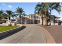 Elegant home with palm trees and a long driveway at 2836 E Dennisport Ct, Gilbert, AZ 85295