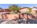 House with a large front yard and mature citrus tree at 3020 E Des Moines St, Mesa, AZ 85213