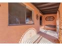 Covered patio with stone flooring and wrought iron details at 3020 E Des Moines St, Mesa, AZ 85213