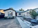 House exterior showcasing a walkway leading to the front entrance at 6931 W Crittenden Ln, Phoenix, AZ 85033