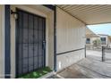 Front door with a decorative security screen and covered entryway at 7028 W Carol Ann Way, Peoria, AZ 85382