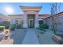 Front entry with walkway, desert landscaping, and security door at 11917 E Mariposa Grande Dr, Scottsdale, AZ 85255