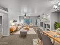 Open concept living and dining area with plush carpet and recessed lighting at 1351 N Pleasant Dr # 2079, Chandler, AZ 85225