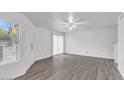 Bright living room with gray vinyl flooring and sliding door at 2040 S Longmore -- # 68, Mesa, AZ 85202