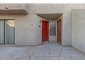 Red side entrance with a small patio area at 2040 S Longmore -- # 68, Mesa, AZ 85202