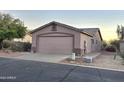 Tan house exterior with a two-car garage and walkway at 2101 S Meridian Rd # 421, Apache Junction, AZ 85120