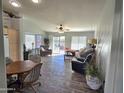 Spacious living room with hardwood floors and access to backyard at 2101 S Meridian Rd # 421, Apache Junction, AZ 85120