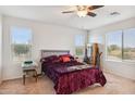 Bright bedroom with large windows and plush bedding at 2924 N Taylor Ln, Casa Grande, AZ 85122