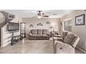 Spacious living room with tile floors and neutral colors at 3630 N French Pl, Casa Grande, AZ 85122