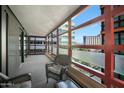 Private balcony with city views and seating for two at 4808 N 24Th St # 621, Phoenix, AZ 85016