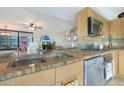 Modern kitchen with granite countertops and stainless steel appliances at 4808 N 24Th St # 621, Phoenix, AZ 85016