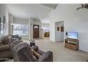 Spacious living room with leather furniture and a view of the kitchen at 8414 N Central Ave # A, Phoenix, AZ 85020