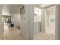 Convenient laundry area with washer and dryer in hallway at 8651 E Royal Palm Rd # 105, Scottsdale, AZ 85258