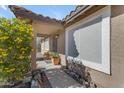 Front entryway with a covered porch, security door, and desert landscaping at 10232 E Fortuna Ave, Gold Canyon, AZ 85118