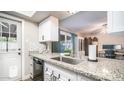 Kitchen features a granite countertop and stainless steel sink at 14821 N 51St Dr, Glendale, AZ 85306