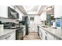 Modern kitchen featuring granite countertops and stainless steel appliances at 14821 N 51St Dr, Glendale, AZ 85306