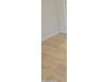 Bright bedroom with light wood-look flooring and white walls at 18802 N 44Th Pl, Phoenix, AZ 85050