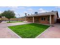 Spacious backyard with grassy area and concrete patio at 19431 N Central Ave, Phoenix, AZ 85024