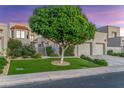 Two-story home with a lush green lawn and mature trees at 8437 N 84Th Pl, Scottsdale, AZ 85258
