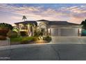 Beautiful home exterior at dusk with attractive landscaping at 16604 S 11Th Ave, Phoenix, AZ 85045