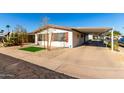 Mobile home with carport and artificial turf at 245 S 56Th St # 75, Mesa, AZ 85206