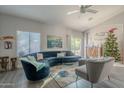 Living room with sectional sofa, decorative accents and a Christmas tree at 3339 E Tonopah Dr, Phoenix, AZ 85050