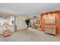 Bright living room with fireplace and adjacent dining area at 5525 E Thomas Rd # N1, Phoenix, AZ 85018