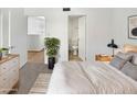 Bedroom with carpeted floors, ensuite bathroom, and additional room access at 3228 W Glendale Ave # 118, Phoenix, AZ 85051