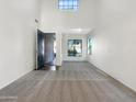 Spacious living room with high ceilings, large windows, and plush carpeting at 4481 E Sundance Ct, Gilbert, AZ 85297