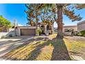 Charming home with two-story elevation, attached garage, and front yard at 7385 E Pleasant Run, Scottsdale, AZ 85258