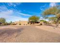 Large home with a brick driveway and desert landscaping at 12550 E Silver Spur St, Scottsdale, AZ 85259