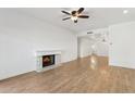 Bright living room with fireplace and wood-look flooring at 5200 S Lakeshore Dr # 204, Tempe, AZ 85283