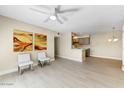Bright living room with hardwood floors and kitchen bar at 5995 N 78Th St # 2050, Scottsdale, AZ 85250