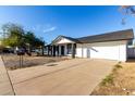 Newly renovated home with updated landscaping and driveway at 7036 W Georgia Ave, Glendale, AZ 85303