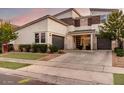 Modern two-story house with attached garage and front yard at 10157 E Texas Ave, Mesa, AZ 85212