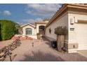 Landscaped front yard with drought-tolerant plants and a brick walkway at 16068 W Edgemont Ave, Goodyear, AZ 85395