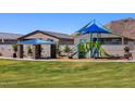 Community playground with slides, climbing wall, and shaded picnic area at 4883 W Hunter Trl, San Tan Valley, AZ 85144