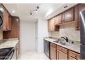 Well-appointed kitchen with ample counter space and modern appliances at 8500 E Indian School Rd # 129, Scottsdale, AZ 85251
