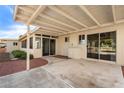 Covered patio with sliding glass doors and a view of the golf course at 925 S Longwood S Loop, Mesa, AZ 85208