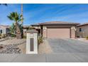 Inviting single-story home with desert landscaping and attached two-car garage at 17774 W Parra Dr, Surprise, AZ 85387