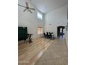 Open concept dining area with high ceilings and wood flooring at 300 S 151St Ave, Goodyear, AZ 85338