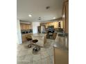Kitchen with wood cabinets, stainless steel appliances, and an island at 300 S 151St Ave, Goodyear, AZ 85338