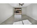 Spacious living area with sliding glass doors leading to the backyard at 19724 N Lief Rd, Maricopa, AZ 85138