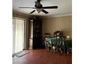 Dining room with dark wood furniture and green tablecloth at 3630 N 86Th Ave, Phoenix, AZ 85037