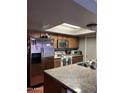 Kitchen with stainless steel appliances and granite countertops at 3630 N 86Th Ave, Phoenix, AZ 85037